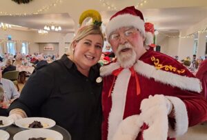 Hawthorns Clevedon employee, and Santa during the Family Christmas Lunch.